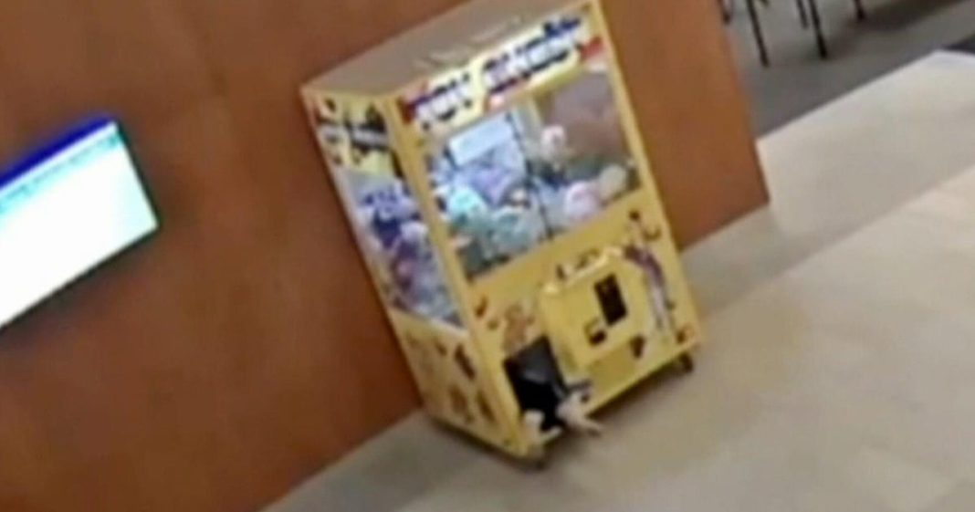 Child rescued after getting stuck in claw machine