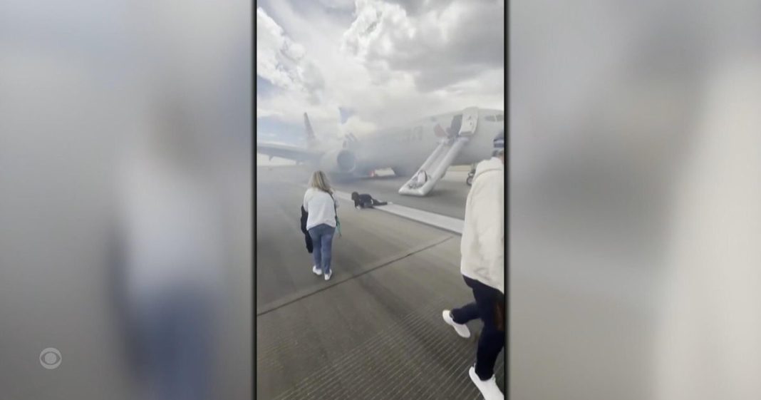 Investigation begins after passengers evacuate burning plane in Denver Investigation begins after passengers evacuate burning plane in Denver